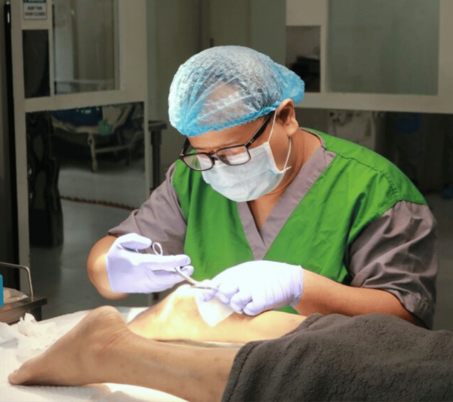 A photo of Dr Tec treating a patient