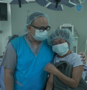 Photo of Dr Tec with a patient