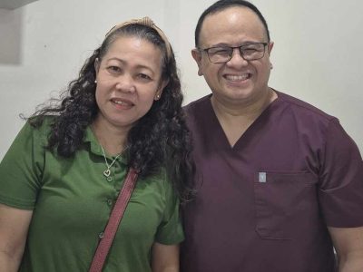 Photo of Dr Tec with a patient